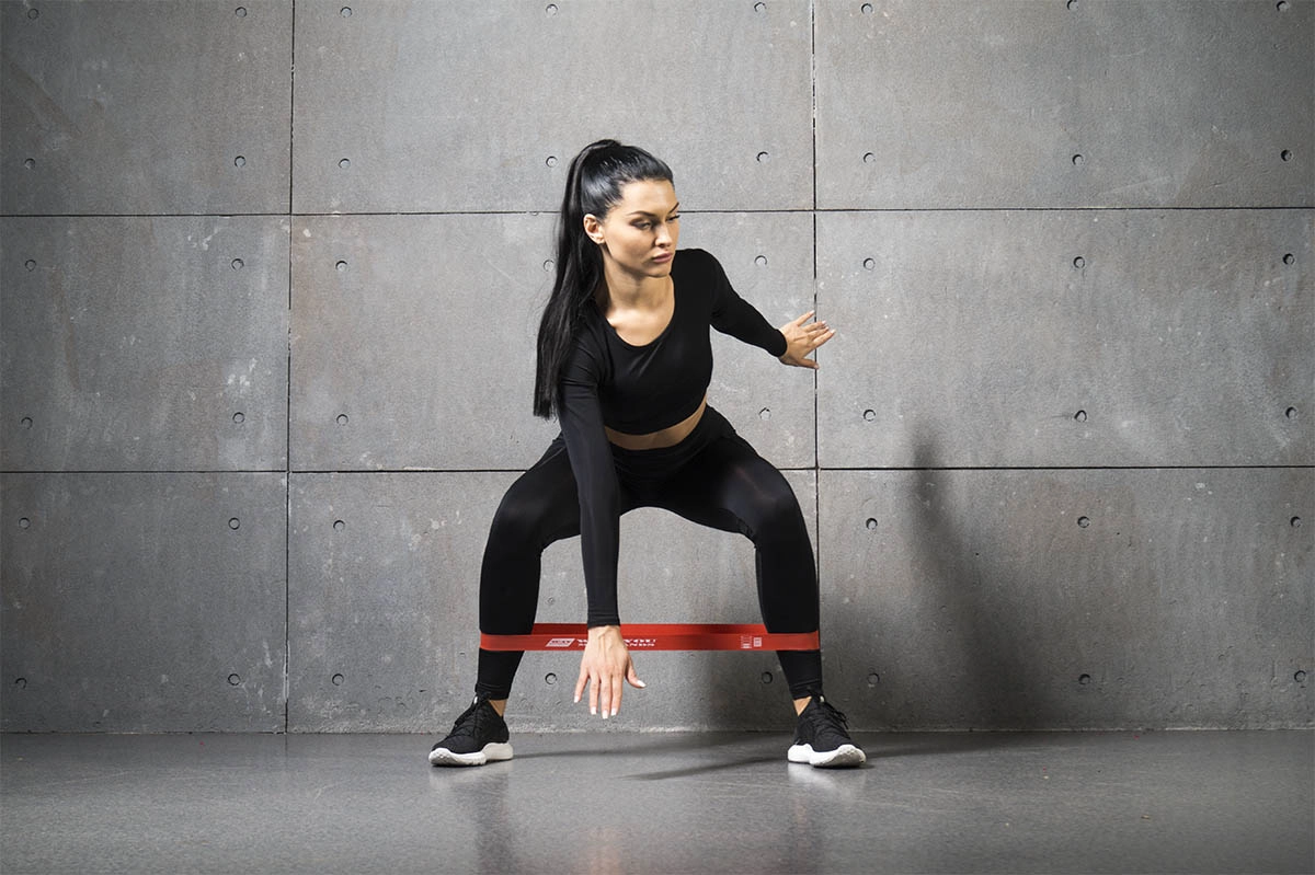 Red resistance band for fitness — on background